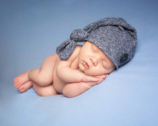 How old should a baby be for newborn photos?